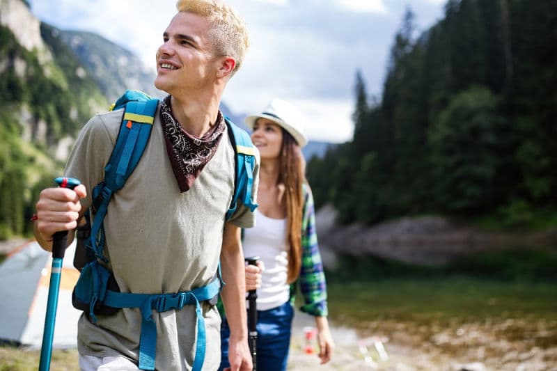three people hiking in the mountains