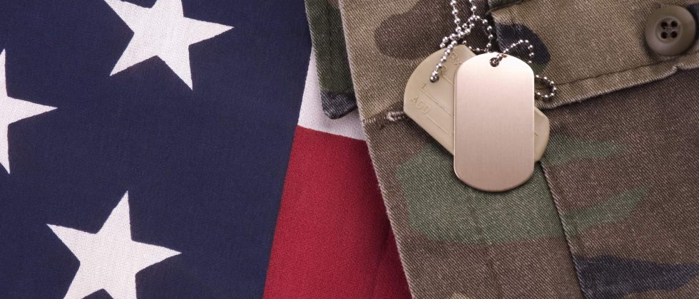 American flag, military uniform and dog tags
