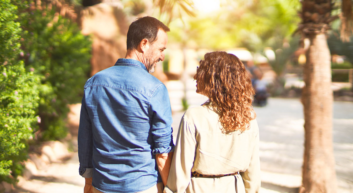 Happy couple walking down the street